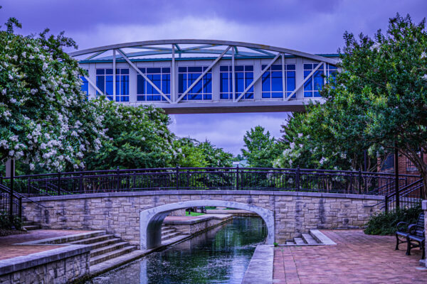 Big Spring Park bridge in Huntsville, Alabama with ducks swimming in canal