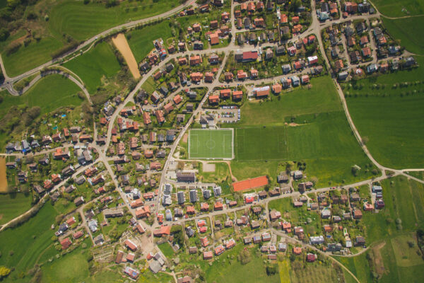 arial view of town and green soccer stadium in Germany